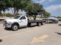 a tow truck parked in a parking lot